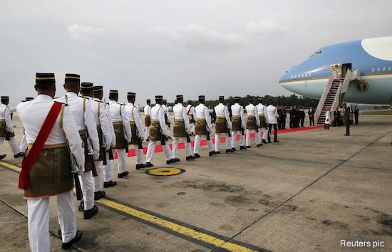 Obama walking up Air Force One