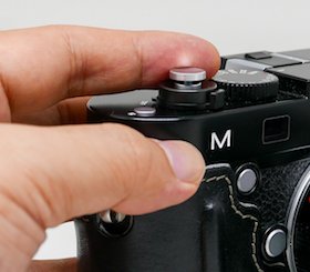 prevent soft shutter release button from falling off